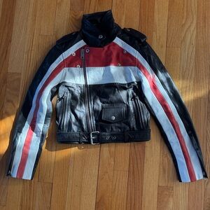 Maje Black biker jacket with red and white stripe.